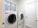 Bright laundry room with side-by-side washer and dryer at 750 Arguello Cir, Mesquite, NV 89027