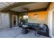 Covered patio with comfortable seating and fire pit at 750 Arguello Cir, Mesquite, NV 89027