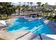 Community pool with lap lanes, lounge chairs, and shaded areas at 750 Arguello Cir, Mesquite, NV 89027