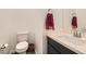 Clean bathroom with dark vanity, single sink, and updated fixtures at 762 Star Estates Ave, North Las Vegas, NV 89086