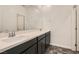 Modern bathroom with double vanity and dark cabinetry at 762 Star Estates Ave, North Las Vegas, NV 89086