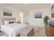 Staged bedroom features neutral décor and comfortable furnishings at 762 Star Estates Ave, North Las Vegas, NV 89086