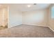 Cozy bedroom with plush carpeting, neutral walls, and ample natural light from the window at 762 Star Estates Ave, North Las Vegas, NV 89086