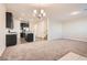 Open concept kitchen and dining area with dark cabinets and an island at 762 Star Estates Ave, North Las Vegas, NV 89086