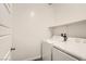 This laundry room features a full-size washing machine and dryer at 762 Star Estates Ave, North Las Vegas, NV 89086