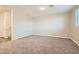 Bright and airy living room with neutral walls and carpeting at 762 Star Estates Ave, North Las Vegas, NV 89086