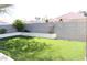 Artificial turf backyard with block wall and raised planter at 7712 Wedlock Ln, Las Vegas, NV 89129