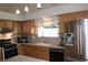 Kitchen with stainless steel appliances and granite countertops at 7712 Wedlock Ln, Las Vegas, NV 89129