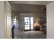 View of the living room from the kitchen area, showing French doors at 7712 Wedlock Ln, Las Vegas, NV 89129