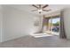 Bedroom with balcony access, ceiling fan and window coverings at 8284 Arden Ladder Pl, Las Vegas, NV 89117