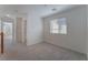 Upstairs bedroom with carpeted floors and a window at 8284 Arden Ladder Pl, Las Vegas, NV 89117