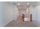 Upstairs hallway with carpeted flooring and access to bedrooms at 8284 Arden Ladder Pl, Las Vegas, NV 89117