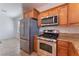 Modern kitchen with stainless steel appliances and granite counters at 8284 Arden Ladder Pl, Las Vegas, NV 89117