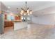 Open kitchen with island and views into the living room at 8284 Arden Ladder Pl, Las Vegas, NV 89117