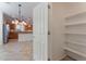 Walk-in pantry offering ample storage shelves at 8284 Arden Ladder Pl, Las Vegas, NV 89117