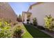 Landscaped backyard with artificial turf and gravel at 844 Via Serenelia, Henderson, NV 89011