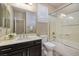 Clean bathroom with dark vanity, shower/tub combo, and updated fixtures at 844 Via Serenelia, Henderson, NV 89011