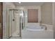 Bathroom with soaking tub and walk-in shower at 844 Via Serenelia, Henderson, NV 89011