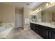 Double vanity bathroom with soaking tub and separate shower at 844 Via Serenelia, Henderson, NV 89011