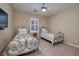 Bedroom with two twin beds and ceiling fan at 844 Via Serenelia, Henderson, NV 89011