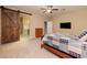 Bedroom with barn door and en-suite bathroom access at 844 Via Serenelia, Henderson, NV 89011