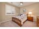 Bedroom with ceiling fan and wood framed bed at 844 Via Serenelia, Henderson, NV 89011