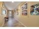 Long hallway with tiled floors and wall art at 844 Via Serenelia, Henderson, NV 89011