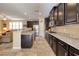 Spacious kitchen with granite countertops and dark wood cabinetry at 844 Via Serenelia, Henderson, NV 89011