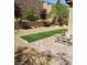 Backyard with artificial turf, paver patio and retaining wall at 889 Ariel Heights Ave, Las Vegas, NV 89138