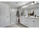 Elegant bathroom with double vanity, large shower, and modern fixtures at 889 Ariel Heights Ave, Las Vegas, NV 89138