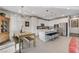 Kitchen with island and adjacent dining area with rustic table at 889 Ariel Heights Ave, Las Vegas, NV 89138