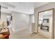 Elegant loft hallway featuring a large mirror and hardwood floors at 889 Ariel Heights Ave, Las Vegas, NV 89138