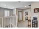 Well-lit loft hallway with access to bedrooms and a full bathroom at 889 Ariel Heights Ave, Las Vegas, NV 89138