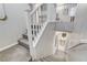 Modern loft stairs leading down to a half bathroom at 889 Ariel Heights Ave, Las Vegas, NV 89138