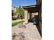 Covered patio with pavers, seating area, and built-in grill at 889 Ariel Heights Ave, Las Vegas, NV 89138