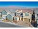 Two-story house with attached garage; neighborhood view at 9008 Rolling Pietra St, Las Vegas, NV 89166