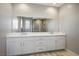 Elegant bathroom with double vanity and white cabinets at 9008 Rolling Pietra St, Las Vegas, NV 89166