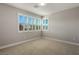 Simple bedroom with large windows and neutral walls at 9008 Rolling Pietra St, Las Vegas, NV 89166