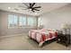 Spacious bedroom with large windows and ceiling fan at 9008 Rolling Pietra St, Las Vegas, NV 89166