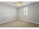 Spacious bedroom with ceiling fan and window shutters at 9008 Rolling Pietra St, Las Vegas, NV 89166