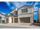 Two-story house with a two-car garage and landscaped front yard at 9008 Rolling Pietra St, Las Vegas, NV 89166