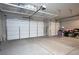 Spacious three-car garage with overhead storage racks at 9008 Rolling Pietra St, Las Vegas, NV 89166