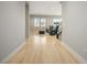 Light-filled hallway with light wood flooring at 9008 Rolling Pietra St, Las Vegas, NV 89166