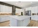 Modern kitchen with white cabinets, large island, and stainless steel appliances at 9008 Rolling Pietra St, Las Vegas, NV 89166