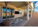 Covered patio with seating area, adjacent to pool at 9008 Rolling Pietra St, Las Vegas, NV 89166