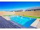 Relaxing pool with water features and grassy area at 9008 Rolling Pietra St, Las Vegas, NV 89166