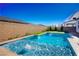 Sparkling blue pool, surrounded by a patio at 9008 Rolling Pietra St, Las Vegas, NV 89166