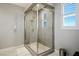 Modern shower with glass enclosure and gray tile at 9008 Rolling Pietra St, Las Vegas, NV 89166