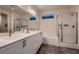 Elegant bathroom with double sinks and a walk-in shower at 9181 Theodore Ct, Las Vegas, NV 89178