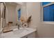 Modern bathroom with double vanity and soaking tub at 9181 Theodore Ct, Las Vegas, NV 89178